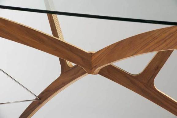 Each Leap Desk, shown here in vaneered structural ply, is handmade in our Brighton workshop from your choice of solid walnut or timber veneer. We like the way a glass top gives the user a clear view of the Leap Desk's unconventional curves, but if you prefer not to stare at your feet while working, a solid top is available too.