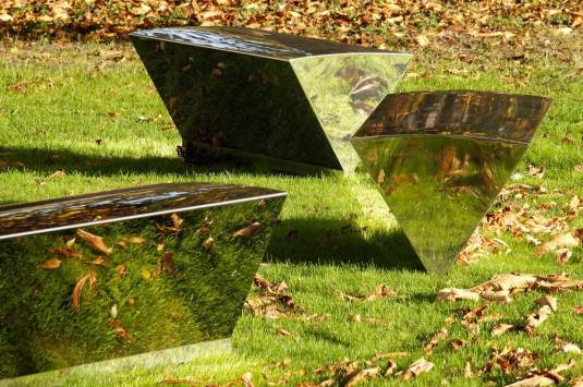 Our Shiny Benches appear to balance on point, vanishing into the environment. This playful garden furniture suite was first commissioned by TTP for Melbourn Science Park and the benches later batch produced by Alexander Rose Ltd .