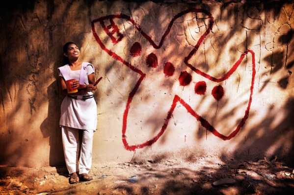 New Delhi, India. Kalyani has painted a plane onto a wall on the roof of her house. Kalyani is 13 years. She lives with her parents and two brothers in one of the slums in Delhi. She likes going to school and has big dreams. She believes that she will be married but she won't stay in the slum like her mother, caring for the children. "In the evening, when I see a plane flying overhead, I dream of being on board. I want to see the world, but I especially want to get out of the slum. As a flight attendant I will travel and literally fly away from my current life."