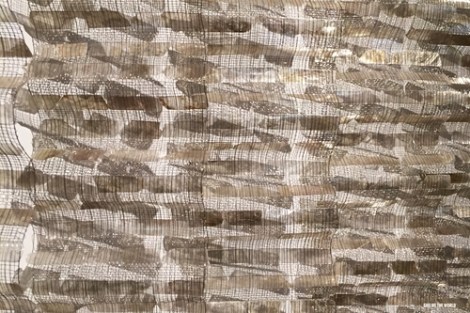 Close up of the textile piece, she typically works with metal incorporating light, weaving, and other dynamic elements.